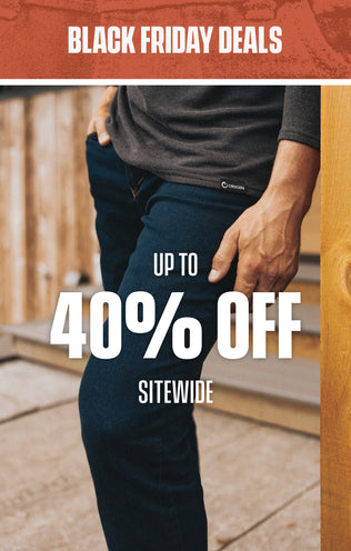 Promotional image for Black Friday deals with a person wearing dark pants and a gray shirt, set against a blurred outdoor background.